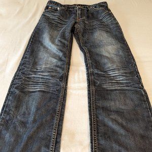 32x32 distressed dark blue denim jeans with embroidered cross pattern